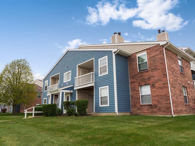 This image shows the vibrant landscape view of the TGM Springbrook Apartments in Aurora, IL.